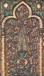 Detail from molded tile, Kashan, 7th/13th century, depicting a mihrab with lamp, symbol of divine light. Click for larger image.